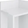 A close-up view of a white shelf unit. Náhled obrázku produktu