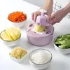 A person is using a pink vegetable slicer to cut a potato, surrounded by bowls of chopped vegetables and potato chips. Náhľad obrázku produktu