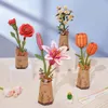 A collection of wooden 3D model flowers in vases, arranged on a surface with a light blue background. Podgląd zdjęcia produktu