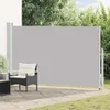 An outdoor patio scene with a retractable side awning, a chair, and some greenery. Produktbild-Vorschau