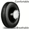 A close-up of a black headphone earpad with stylized white lines representing air flow, indicating breathability. Produktbild-Vorschau