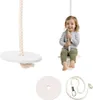 A child is sitting on a wooden swing seat, with other parts of the swing set displayed separately. Voir les images du produit