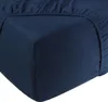 A close-up view of a navy blue fitted sheet corner. Produktbild-Vorschau