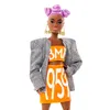 Barbie BMR1959 Barbie (cheveux violets) Blazer à carreaux Voir les images du produit 3