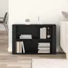 A black wooden sideboard with books and decorative items on it, placed in a room with a chair and a sofa. Produktbild-Vorschau