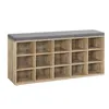 A shoe bench with multiple compartments and a gray cushion on top. Produktbild-Vorschau