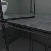 A close-up view of a modern bathroom with a toilet and a shower enclosure. Produktbild-Vorschau
