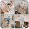 Collage of four images showing a wooden children's workbench and accessories, with a child's hand interacting with the tools in one image. Produktbild-Vorschau