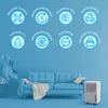 A living room scene with a blue sofa and a dehumidifier. Produktbild-Vorschau