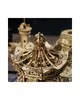 A close-up view of a wooden carousel model, with intricate details visible. Náhľad obrázku produktu