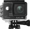 A front view of an SJCAM SJ5000X action camera in its waterproof housing, mounted on a tripod adapter. Produktbild-Vorschau