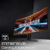 A curved computer monitor displaying a futuristic graphic with the GIGABYTE logo, set against a dark, textured background. Voir les images du produit