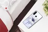 A phone case with a floral design is placed on a bedside table next to a bed and a small plant. Produktbild-Vorschau