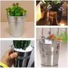 Collage of four images showing mini metal flower pots with plants. Produktbild-Vorschau