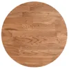 A circular wooden tabletop made of light brown oak wood, showing the grain and wood planks. Anteprima dell’immagine prodotto