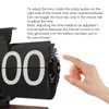 A hand is shown adjusting a black flip clock. Náhled obrázku produktu