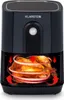 A black air fryer with a whole roasted chicken inside, showing the circulation of hot air. Produktbild-Vorschau