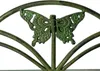 A close-up of a decorative metal butterfly on a garden bench. Anteprima dell’immagine prodotto