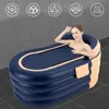 A woman is relaxing in an inflatable bathtub. Podgląd zdjęcia produktu