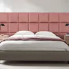 A bedroom scene with a bed and a pink upholstered headboard. Anteprima dell’immagine prodotto