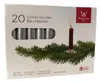 A box of chime candles with a Christmas tree branch illustration. Produktbild-Vorschau