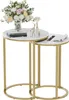 A set of two nesting side tables with marble-look tops and gold metal frames, decorated with a floral arrangement and small decorative items. Náhled obrázku produktu