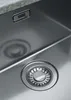 A close-up view of a stainless steel sink with a drain. Náhled obrázku produktu