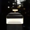 A close-up shot of a black and white solar post light with a light emitting from the bottom section. Voir les images du produit
