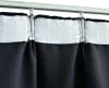 Close-up of dark curtains hanging from a track. Anteprima dell’immagine prodotto