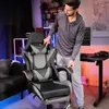 A man is adjusting a gaming chair in a room with gaming-themed decor. Produktbild-Vorschau
