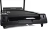 A close-up, low-angle shot of a black treadmill, focusing on the front end and the running belt. Podgląd zdjęcia produktu