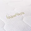 A close-up view of a white quilted fabric with a gold embroidered logo and text that says "Aloe Vera". Produktbild-Vorschau