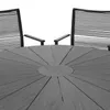 A close-up view of a round outdoor dining table and two chairs. Produktbild-Vorschau