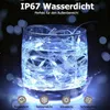 A string of lights submerged in a glass of water, with text overlays indicating waterproof features. Produktbild-Vorschau