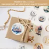 A gift box with a Ramadan-themed sticker and a gold chain on a light-colored surface, surrounded by other Ramadan-themed stickers. Produktbild-Vorschau