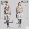 Two women are shown wearing oversized hoodies, with size and measurement indicators. Produktbild-Vorschau