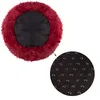 A round dog bed with a fluffy burgundy exterior and a black interior, shown with a close-up of its anti-slip bottom. Náhled obrázku produktu