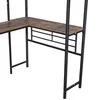 A close-up view of a corner of a l-shaped desk with a wood-grain finish and black metal legs and supports. Voir les images du produit