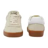 Two views of a pair of beige Lacoste sneakers with gum soles, shown against a white background. Produktbild-Vorschau