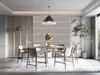 A dining room with a table and chairs, featuring decorative wall panels. Anteprima dell’immagine prodotto