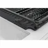 A close-up of a black dish rack with water draining into a white sink. Podgląd zdjęcia produktu