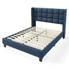A blue upholstered bed frame with a slatted base, shown from a three-quarter angle against a white background. Produktbild-Vorschau