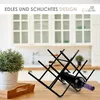 A black metal wine rack holding one bottle of wine, placed on a wooden table in a kitchen setting with cabinets in the background. Produktbild-Vorschau