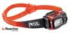 A red and black Petzl Swift RL headlamp with an orange adjustable strap, shown against a white background. Produktbild-Vorschau