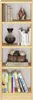A wooden bookshelf filled with books and decorative items. Produktbild-Vorschau