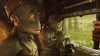 Two alien characters looking out a window on what appears to be a train or vehicle. Produktbild-Vorschau
