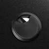 A close-up view of a black cable grommet on a black textured surface. Náhled obrázku produktu