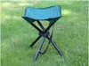 A green foldable stool is placed on a grassy lawn. Anteprima dell’immagine prodotto