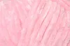 A close-up, textured view of pink yarn. Produktbild-Vorschau