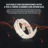 A white headphone cable is coiled on a black background with red musical notes and sound waves. Podgląd zdjęcia produktu